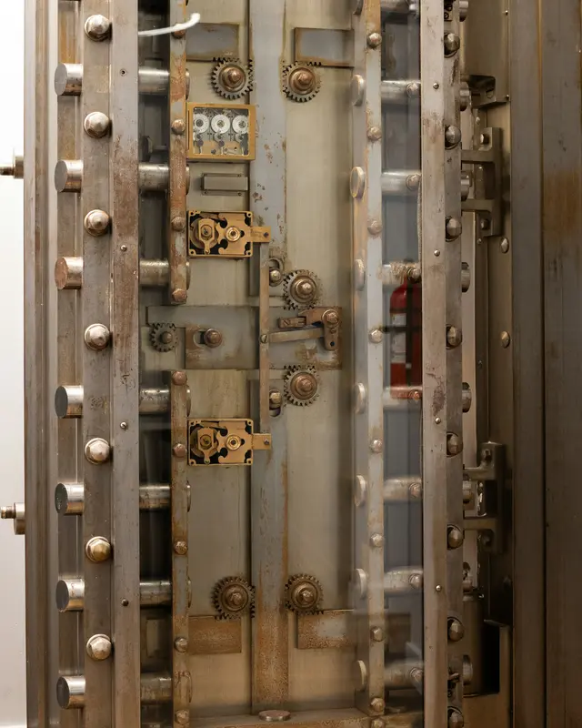 Heavy steel bank vault door with locking bolts